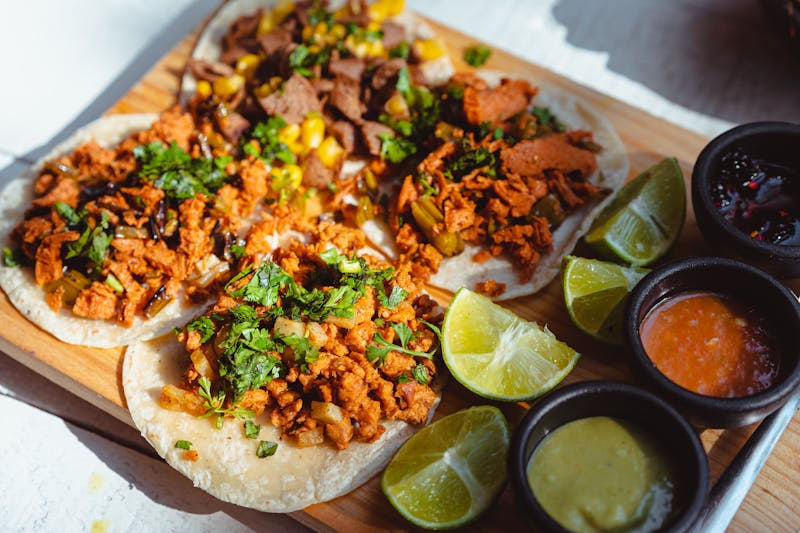 Grilled chicken tacos with fresh toppings at Chuys